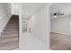 Bright hallway with staircase leads to garage and bedroom with ceiling fan at 834 N Oregon Ave, Tampa, FL 33606
