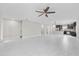 Bright and open living space with tile flooring, recessed lighting, and seamless flow to the kitchen at 834 N Oregon Ave, Tampa, FL 33606