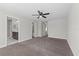 Spacious main bedroom features a ceiling fan, neutral paint, and carpeted floors at 834 N Oregon Ave, Tampa, FL 33606