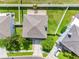 Overhead view of the house showing the roof, backyard, and surrounding neighborhood at 8806 Bayaud Dr, Tampa, FL 33626