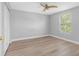 Bright bedroom features a modern ceiling fan and natural light from window at 8806 Bayaud Dr, Tampa, FL 33626