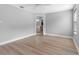 Bedroom features laminate floors and an ensuite bathroom at 8806 Bayaud Dr, Tampa, FL 33626