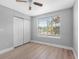 Bright bedroom features laminate floors, closet, and natural light from window at 8806 Bayaud Dr, Tampa, FL 33626