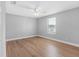 Light-filled bedroom features laminate flooring and a modern ceiling fan at 8806 Bayaud Dr, Tampa, FL 33626