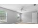 Bright bedroom with wood look floors and natural light from multiple windows at 8806 Bayaud Dr, Tampa, FL 33626