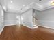 Spacious living room with hardwood floors, recessed lighting, and a staircase, perfect for Gathering gatherings at 8806 Bayaud Dr, Tampa, FL 33626