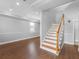 The living room features elegant hardwood floors and a staircase, offering a comfortable living space at 8806 Bayaud Dr, Tampa, FL 33626