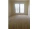 Bright bedroom with two windows offering plenty of natural light and neutral carpeting at 9320 Crescent Loop Cir # 304, Tampa, FL 33619