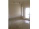 Bonus room with wall to wall carpet and door to the exterior at 9320 Crescent Loop Cir # 304, Tampa, FL 33619