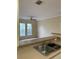 Kitchen view with double stainless sink and neutral color palette at 9320 Crescent Loop Cir # 304, Tampa, FL 33619