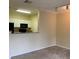 Bright living space next to the kitchen with track lighting at 9320 Crescent Loop Cir # 304, Tampa, FL 33619
