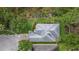 Stunning aerial view of the property showing its lush landscaping, winding walkways, and pristine rooftop at 9327 Hunters Park Way, Tampa, FL 33647