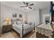 Bedroom showcasing a metal bed frame, side tables with lamps, and a closet at 9327 Hunters Park Way, Tampa, FL 33647