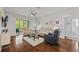Bright living room with hardwood floors and sliding doors to the outdoor area at 9327 Hunters Park Way, Tampa, FL 33647