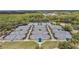 Amazing aerial image of multiple community tennis courts surrounded by trees at 9327 Hunters Park Way, Tampa, FL 33647