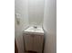 Bathroom with a white vanity and cabinet with white tiled walls at 9907 Maggie St, Gibsonton, FL 33534