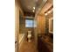 Remodeled bathroom with tiled walls, modern fixtures, and a bathtub at 9907 Maggie St, Gibsonton, FL 33534