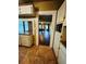 Classic kitchen view shows access to the living area and window for natural light at 9907 Maggie St, Gibsonton, FL 33534
