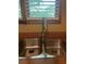 Close up of the stainless steel kitchen sink with window at 9907 Maggie St, Gibsonton, FL 33534