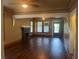 Large living room featuring hardwood floors, natural light, and a traditional fireplace at 9907 Maggie St, Gibsonton, FL 33534