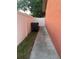 Side yard with fence and trash cans at 9907 Maggie St, Gibsonton, FL 33534