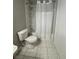 Cozy bathroom featuring a shower over tub and marbled tile flooring at 10823 Brickside Ct, Riverview, FL 33579