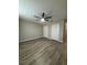 Spacious bedroom with wood-look floors, with white trim and double closets at 10823 Brickside Ct, Riverview, FL 33579
