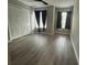 Bedroom with wood-look flooring and ample closet space at 10823 Brickside Ct, Riverview, FL 33579