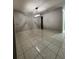 Dining room featuring tile flooring, modern light fixture, and neutral paint at 10823 Brickside Ct, Riverview, FL 33579