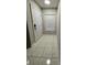 Foyer featuring tile floors, front door and natural light at 10823 Brickside Ct, Riverview, FL 33579
