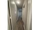 Hallway featuring laminate flooring and neutral paint at 10823 Brickside Ct, Riverview, FL 33579