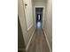 Hallway featuring laminate flooring and neutral paint at 10823 Brickside Ct, Riverview, FL 33579