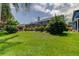 Expansive backyard showcasing the home's screened enclosure and lush greenery, providing privacy and a connection with nature at 11121 Clayridge Dr, Tampa, FL 33635