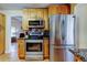 Modern kitchen with stainless steel appliances, granite countertops, custom cabinets and tile backsplash at 11121 Clayridge Dr, Tampa, FL 33635