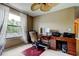 Bright office area with a large window, desk, and ample workspace at 11121 Clayridge Dr, Tampa, FL 33635