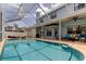 Spacious screened-in pool with ample seating and outdoor dining space, ideal for entertaining and enjoying the Florida lifestyle at 11121 Clayridge Dr, Tampa, FL 33635