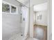 Bathroom with glass shower and view into another room at 1178 Fraser Pine Blvd, Sarasota, FL 34240