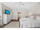 Bright bedroom featuring a comfortable queen-size bed, dresser, and hardwood floors at 1178 Fraser Pine Blvd, Sarasota, FL 34240