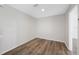 Empty bedroom with a neutral color palette and wood floors at 1178 Fraser Pine Blvd, Sarasota, FL 34240