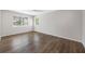 Bedroom with hard wood floors, a ceiling fan, and a large window at 1178 Fraser Pine Blvd, Sarasota, FL 34240