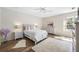 Comfortable bedroom with a queen bed, dresser, and a window at 1178 Fraser Pine Blvd, Sarasota, FL 34240