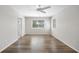 Spacious bedroom with wood floors, large window, and an ensuite bathroom at 1178 Fraser Pine Blvd, Sarasota, FL 34240