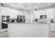 Bright kitchen features white cabinets, stainless steel appliances, and granite countertops, creating a modern cooking space at 1178 Fraser Pine Blvd, Sarasota, FL 34240