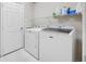 Laundry room equipped with a modern washer and dryer for household convenience at 1178 Fraser Pine Blvd, Sarasota, FL 34240