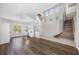 Bright and airy living room with wood floors, high ceilings, and plenty of natural light at 1178 Fraser Pine Blvd, Sarasota, FL 34240