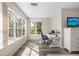 Bright office space with large windows, hardwood floors, and a modern desk setup at 1178 Fraser Pine Blvd, Sarasota, FL 34240
