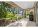 A screened patio offers views of the lush backyard at 1178 Fraser Pine Blvd, Sarasota, FL 34240
