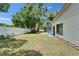 Expansive backyard featuring a white fence, manicured lawn, and plenty of space for outdoor activities at 1207 Oak Valley Dr, Seffner, FL 33584