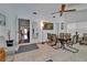 Bright dining area featuring tiled floors, a glass table, and a ceiling fan at 1207 Oak Valley Dr, Seffner, FL 33584