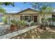 Charming single-story home featuring a well-manicured lawn and a welcoming front porch at 1207 Oak Valley Dr, Seffner, FL 33584